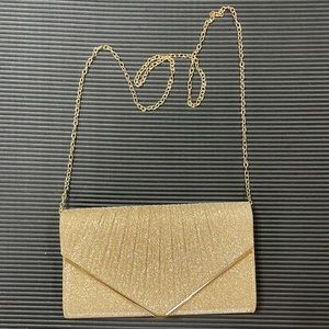 Gold sparkling clutch